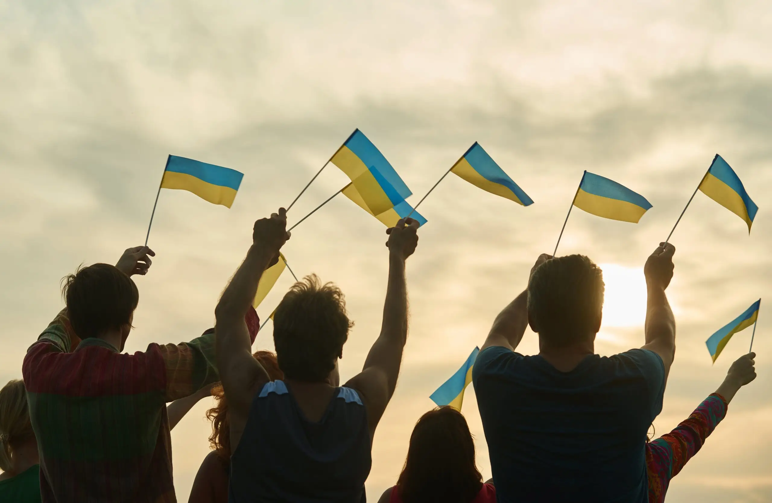 young-people-waving-ukraininan-flags-back-view-2021-09-14-16-12-16-utc-scaled
